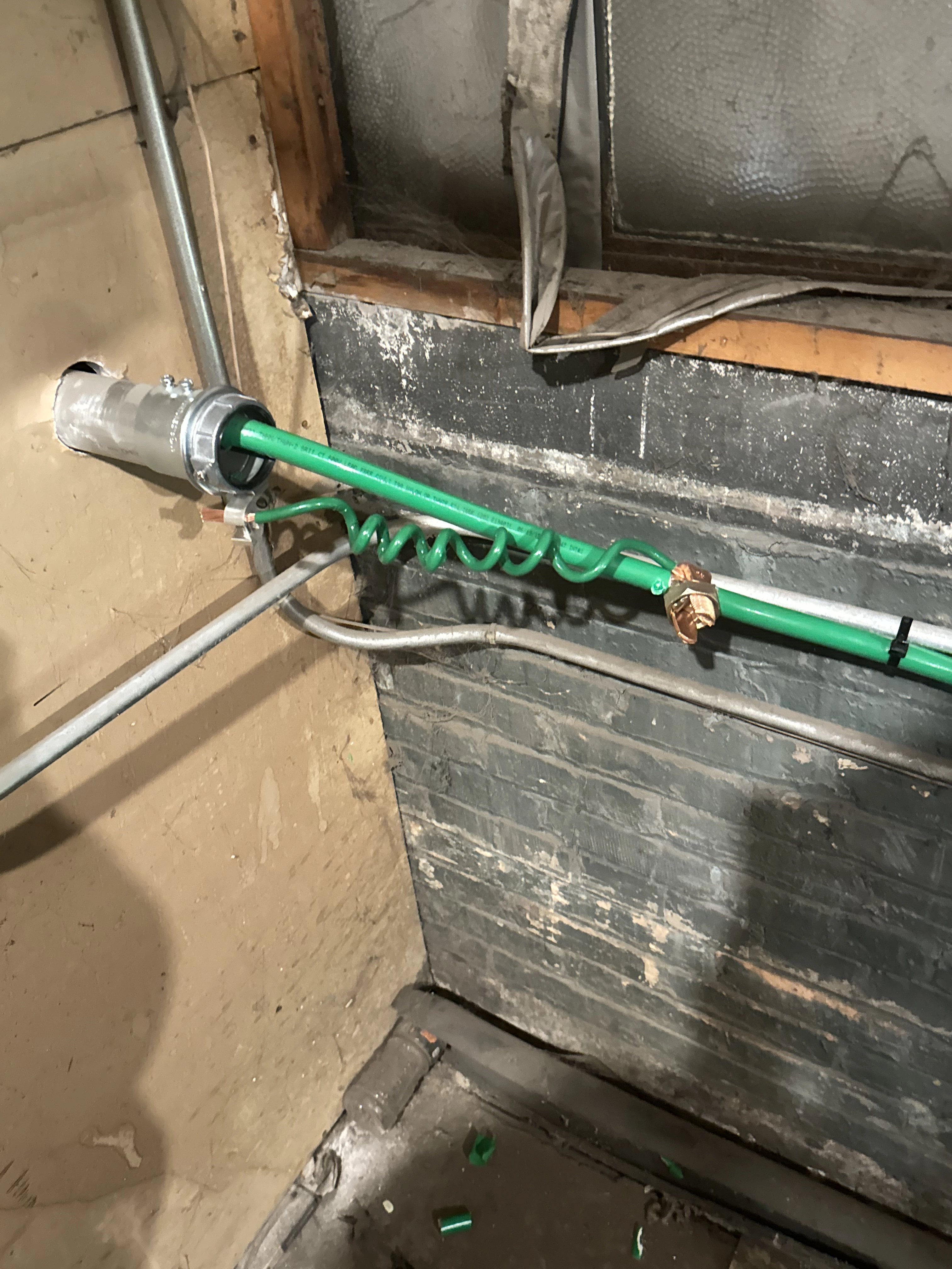Green and wire whites running through an interior wall