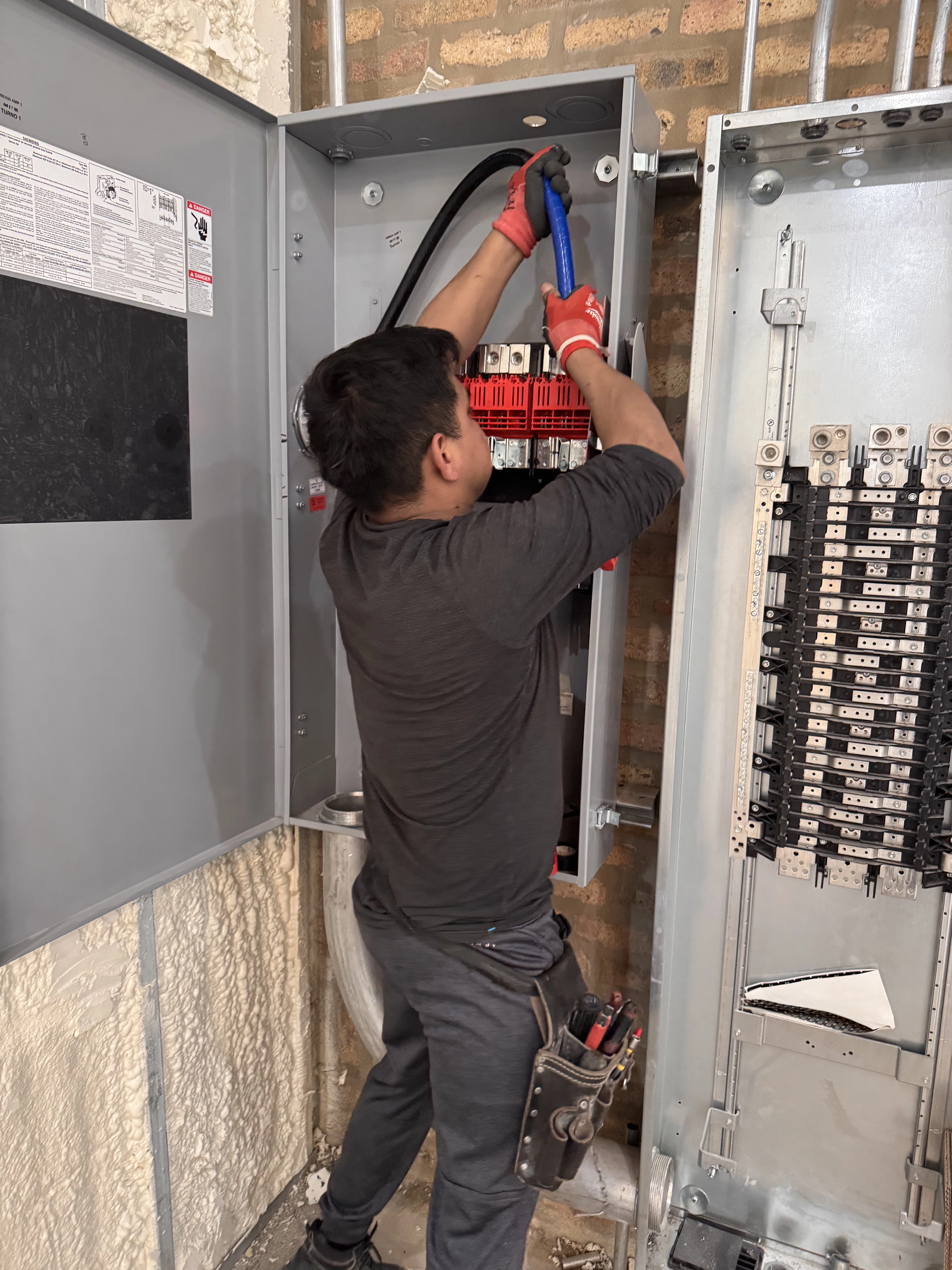 Electrician working on electrical box