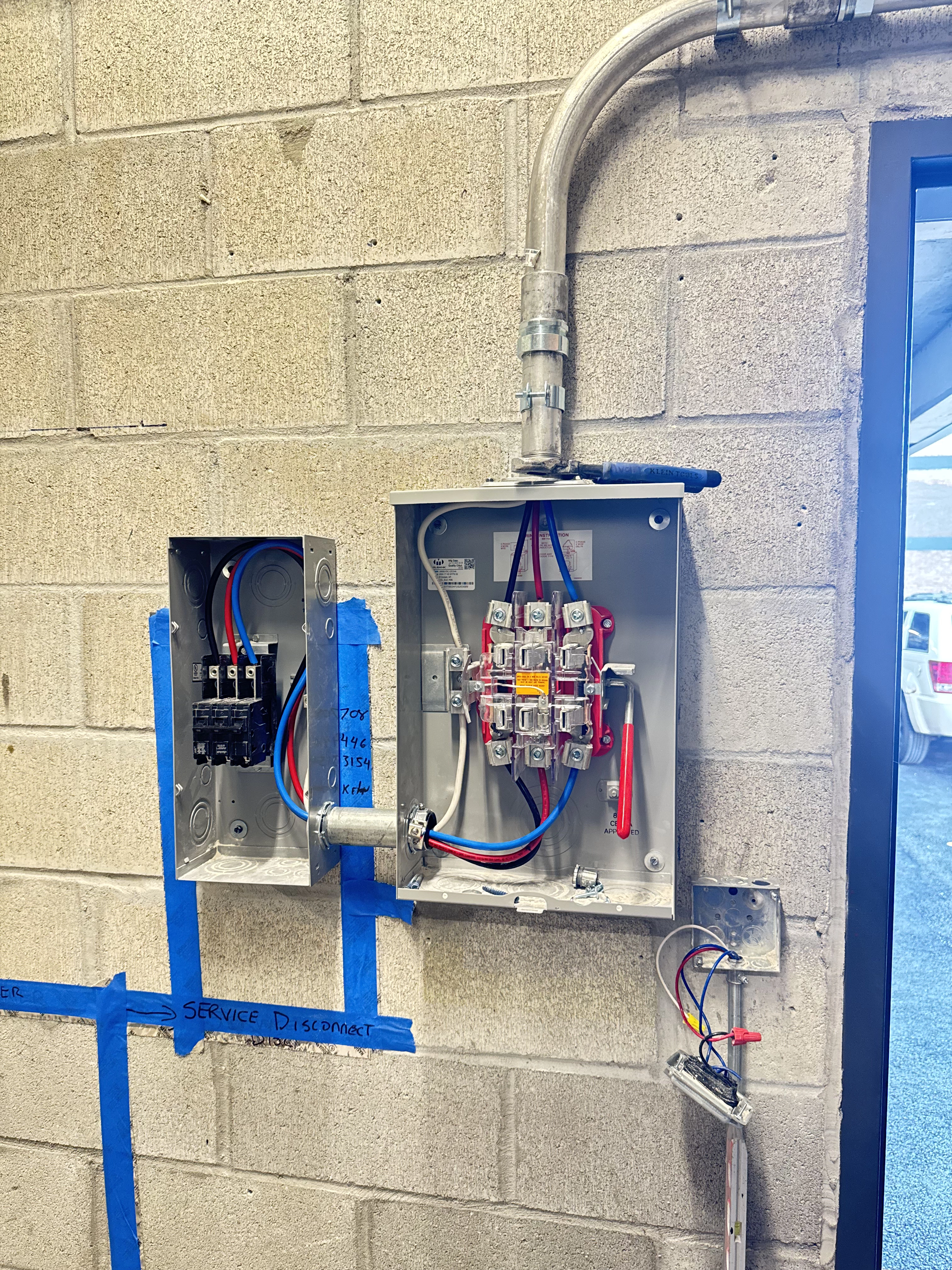 Indoor double electrical box installation with white, black, red, and blue wires